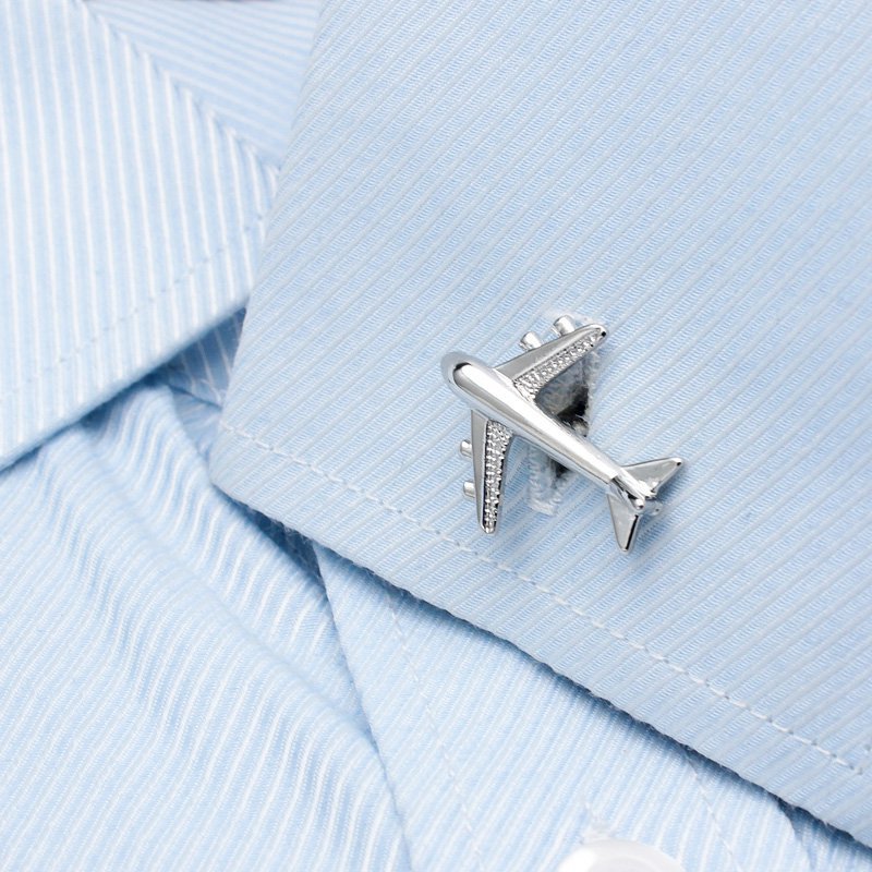 A pair of luxurious Air Bus cufflinks made from titanium alloy with chrome plating, featuring a detailed Air Bus design, presented in a stylish box.