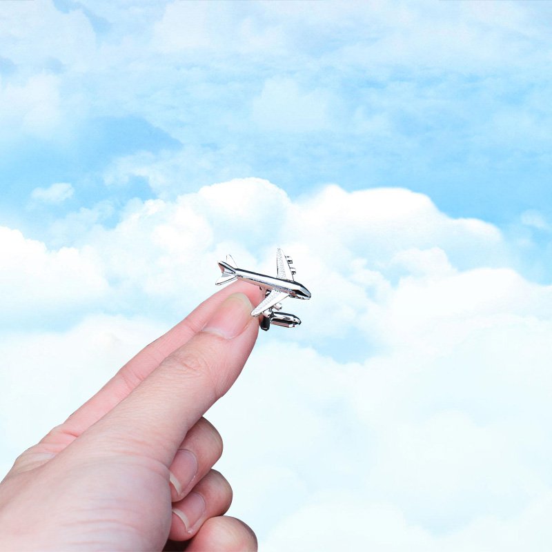 A pair of luxurious Air Bus cufflinks made from titanium alloy with chrome plating, featuring a detailed Air Bus design, presented in a stylish box.