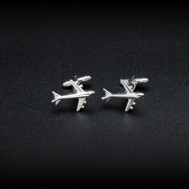 A pair of luxurious Air Bus cufflinks made from titanium alloy with chrome plating, featuring a detailed Air Bus design, presented in a stylish box.