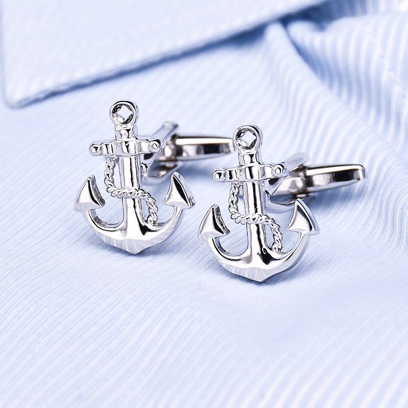 A pair of elegant anchor cufflinks made from titanium alloy, featuring a polished surface finish, displayed in a hard-sided presentation box.