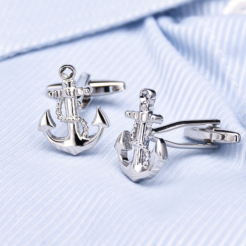 A pair of elegant anchor cufflinks made from titanium alloy, featuring a polished surface finish, displayed in a hard-sided presentation box.