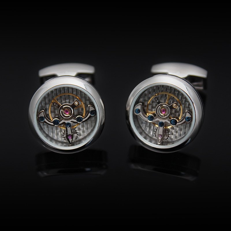 A pair of Automatic Watch Engine Cufflinks made from titanium, showcasing intricate watch mechanics, presented in an elegant gift box.