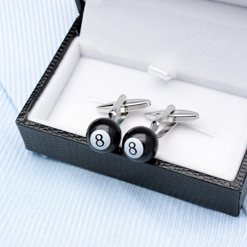 A pair of stylish billiards-themed cufflinks made from titanium alloy, featuring a vivid design, displayed in a hard-sided presentation box.