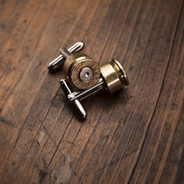 Elegant brass Bullet Cufflinks displayed in a gift box, perfect for formal wear.