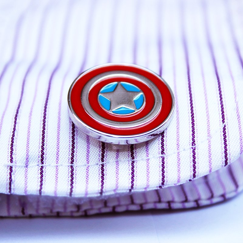 A pair of Captain America Shield Cufflinks made of stainless steel with a rhodium plated finish, displayed in a hard-sided presentation box.