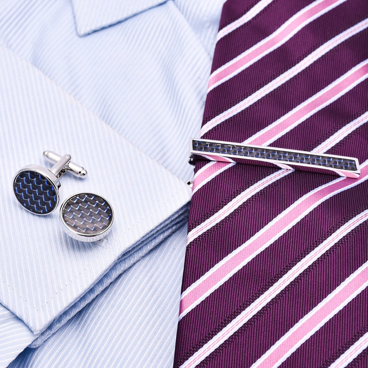 A stylish Carbon Fibre Cufflinks and Stickpin Set featuring genuine carbon fiber and titanium alloy, elegantly presented in a hard-sided box.