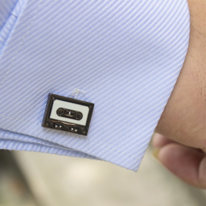 Stylish stainless steel cassette cufflinks with rhodium plating, featuring a unique cassette design, presented in a hard-sided gift box.