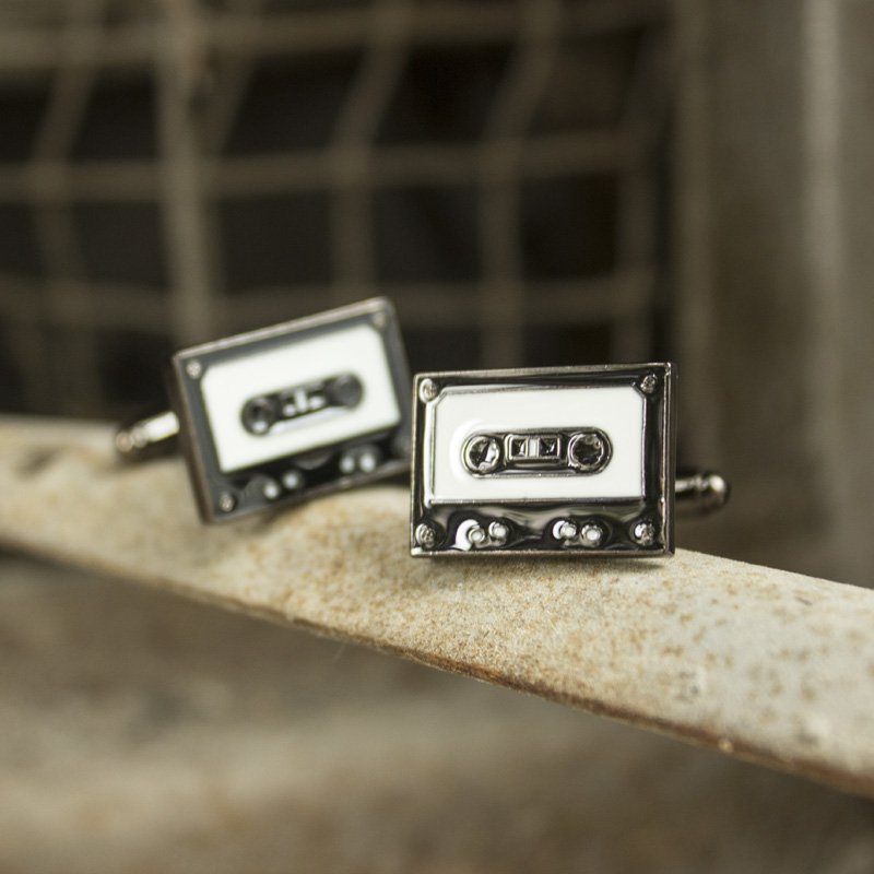 Stylish stainless steel cassette cufflinks with rhodium plating, featuring a unique cassette design, presented in a hard-sided gift box.