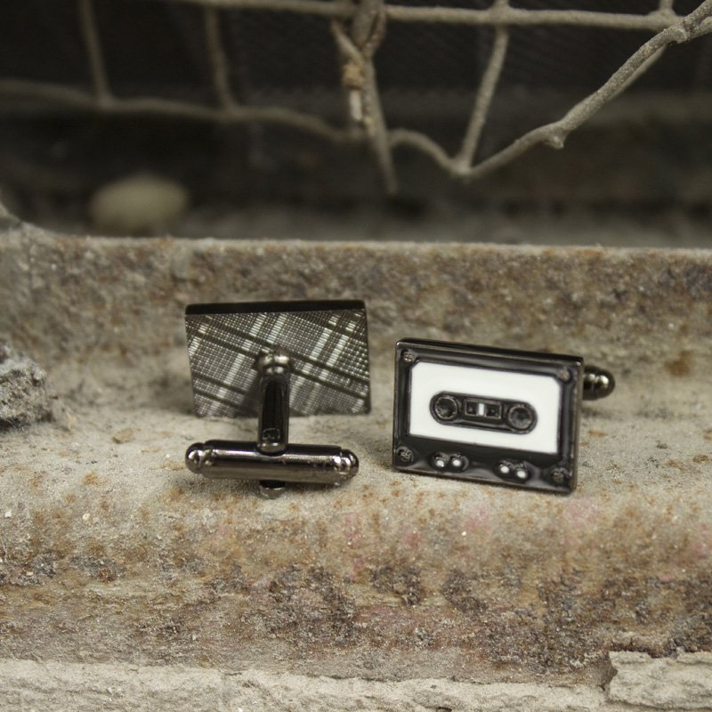 Stylish stainless steel cassette cufflinks with rhodium plating, featuring a unique cassette design, presented in a hard-sided gift box.