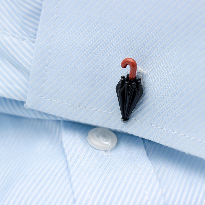 A pair of Chaplin's Hat & Umbrella Cufflinks made from titanium alloy, featuring a unique design inspired by Charlie Chaplin's iconic hat and umbrella.