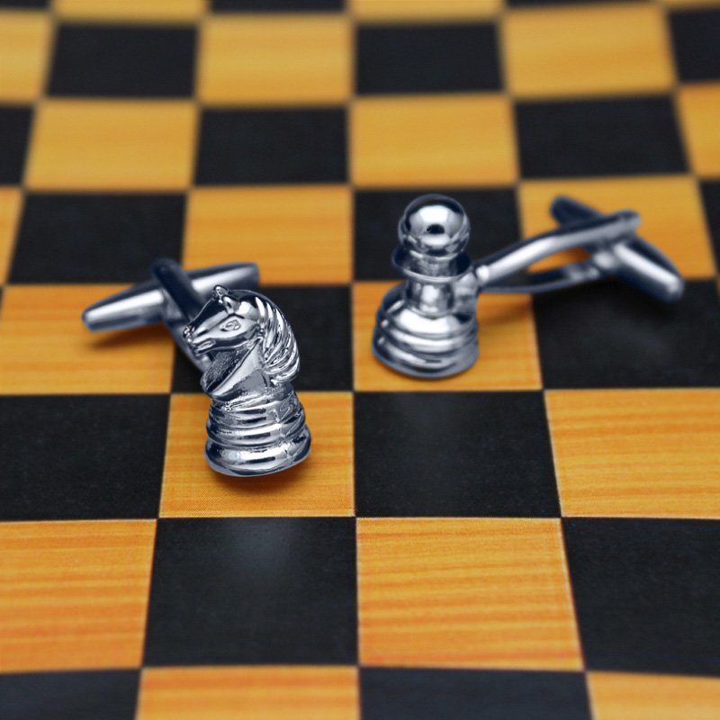 Stylish Chess Cufflinks made from titanium alloy, featuring intricate chess piece designs, presented in a hard-sided gift box.