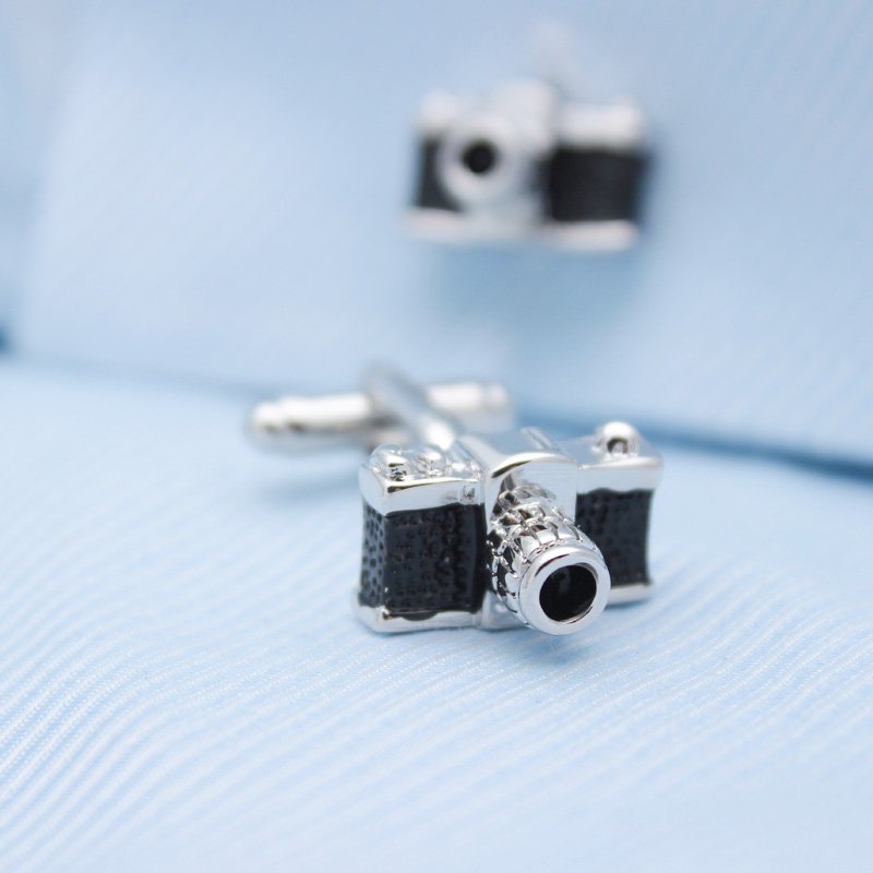 A pair of stylish Classic Camera Cufflinks made from titanium alloy, featuring intricate camera designs, presented in a hard-sided gift box.