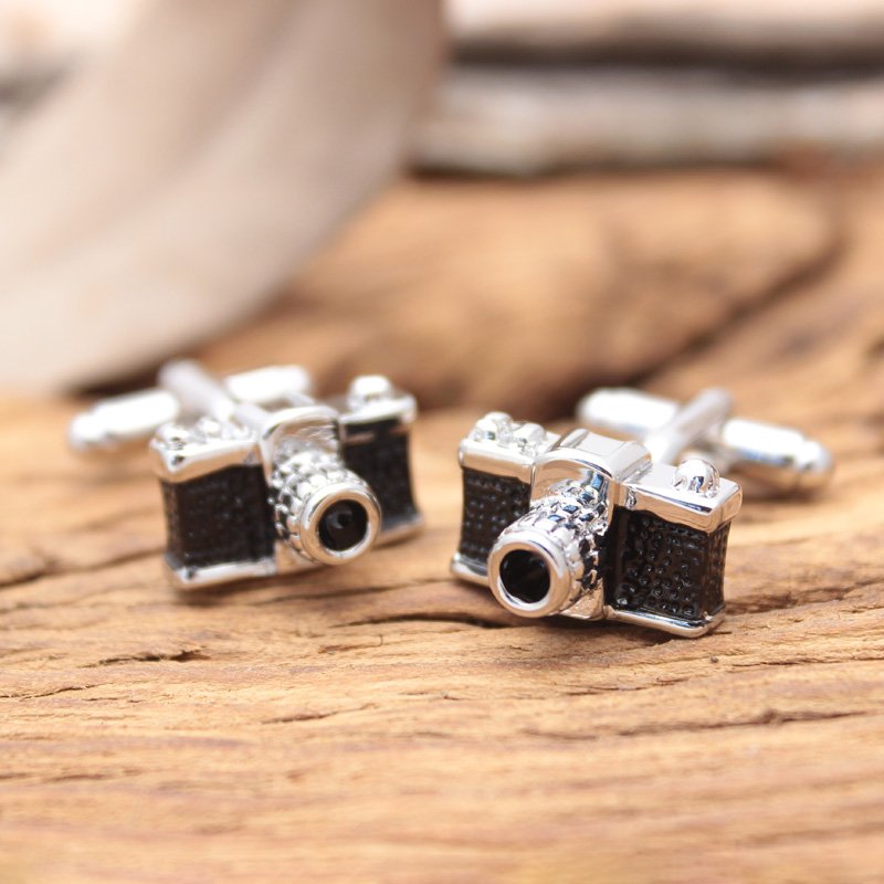 A pair of stylish Classic Camera Cufflinks made from titanium alloy, featuring intricate camera designs, presented in a hard-sided gift box.