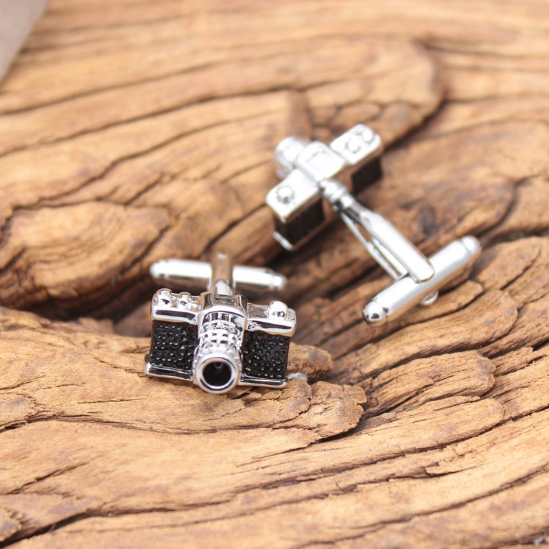 A pair of stylish Classic Camera Cufflinks made from titanium alloy, featuring intricate camera designs, presented in a hard-sided gift box.