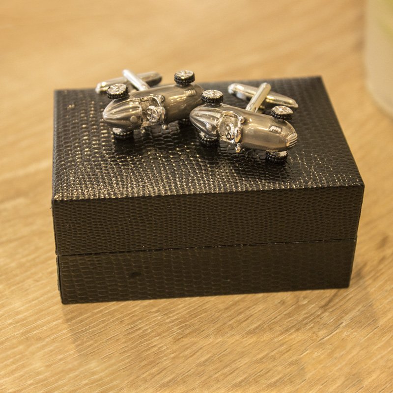 A pair of elegant stainless steel cufflinks featuring a unique classic car design, rhodium plated for a polished finish, displayed in a presentation box.