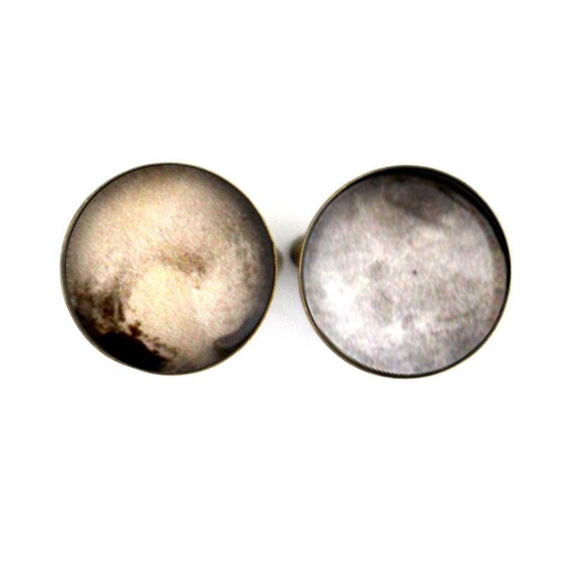 A pair of antique bronze and silver tone cufflinks featuring detailed images of Pluto and its moon Charon, handcrafted from rhodium plated brass and glass.