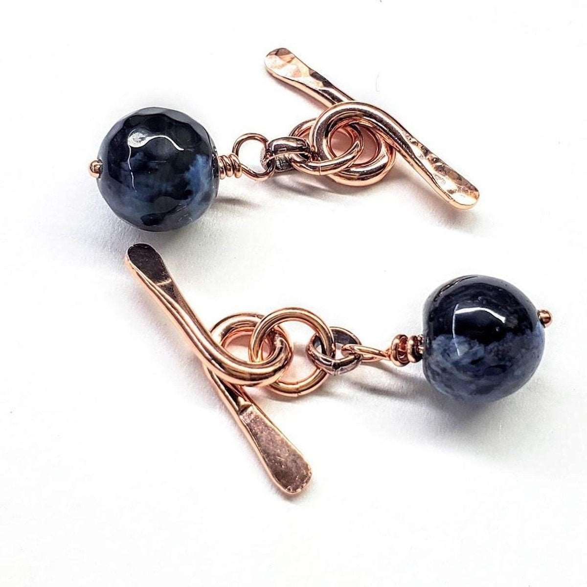 Handcrafted copper cufflinks featuring unique black blue crackle agate beads, symbolizing child abuse awareness with elegant rose gold hammered toggle.