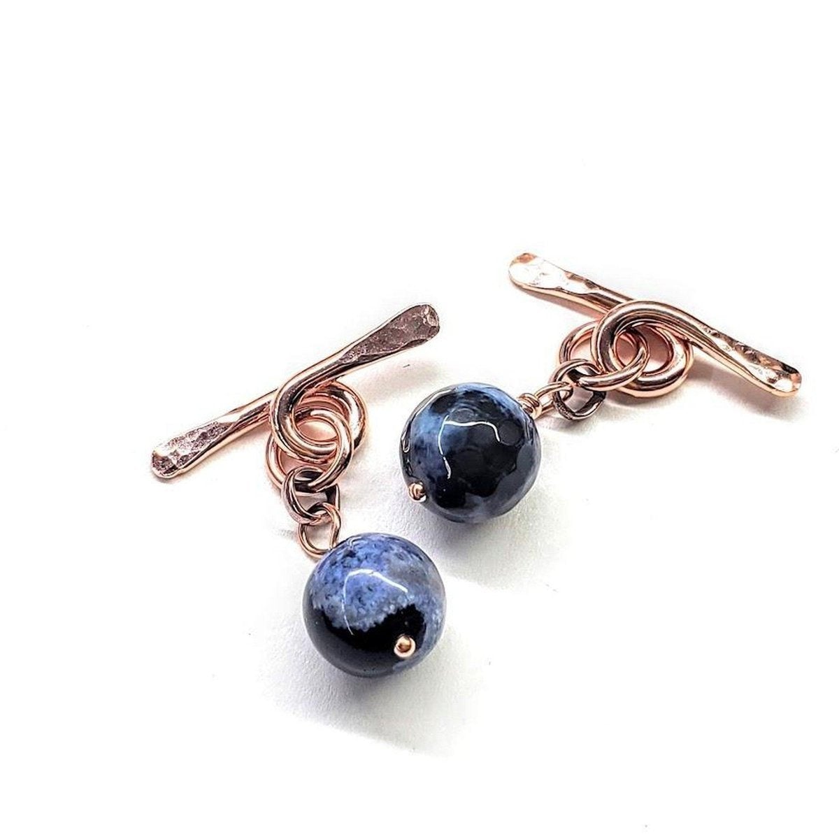 Handcrafted copper cufflinks featuring unique black blue crackle agate beads, symbolizing child abuse awareness with elegant rose gold hammered toggle.