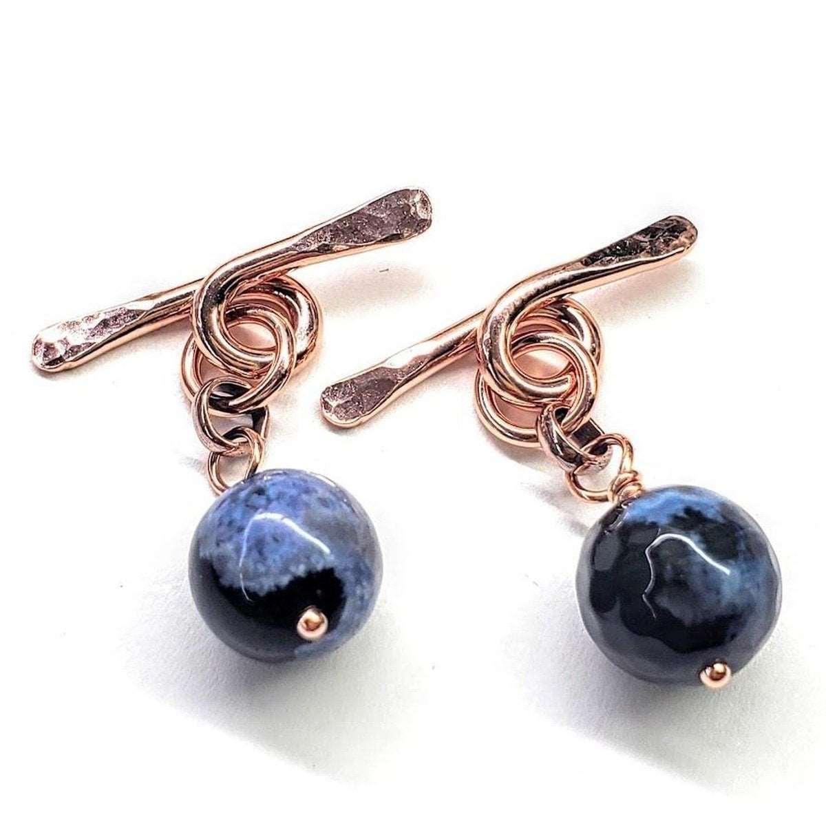 Handcrafted copper cufflinks featuring unique black blue crackle agate beads, symbolizing child abuse awareness with elegant rose gold hammered toggle.