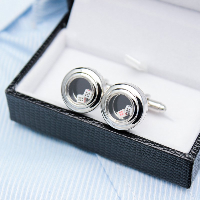 A pair of stylish Dice Cup Cufflinks made from titanium alloy, featuring miniature dice inside a cup design, presented in an elegant gift box.