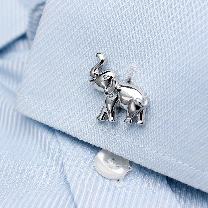 A pair of elegant elephant cufflinks made from titanium alloy, featuring a polished finish and intricate design, presented in a stylish gift box.