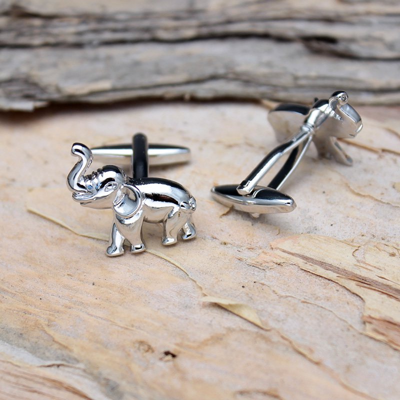 A pair of elegant elephant cufflinks made from titanium alloy, featuring a polished finish and intricate design, presented in a stylish gift box.