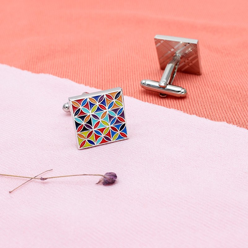 A pair of luxurious Enamel Art Cufflinks made from titanium alloy, featuring vibrant handcrafted enamel designs, presented in a stylish box.