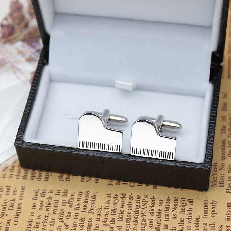 Elegant Grand Piano Cufflinks made from titanium alloy, featuring a polished finish and unique piano design, presented in a luxurious gift box.