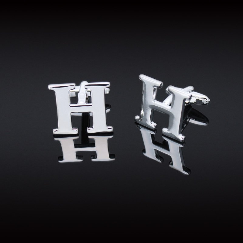 A pair of elegant H Cufflinks made from brass and chrome plated, featuring capitalized alphabets A-Z, displayed in a luxurious presentation box.