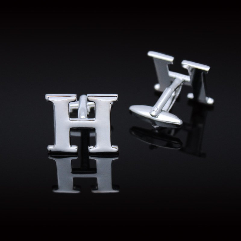 A pair of elegant H Cufflinks made from brass and chrome plated, featuring capitalized alphabets A-Z, displayed in a luxurious presentation box.