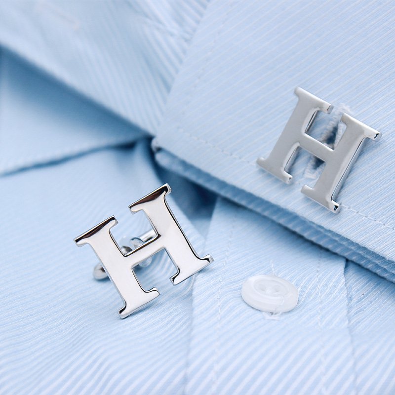 A pair of elegant H Cufflinks made from brass and chrome plated, featuring capitalized alphabets A-Z, displayed in a luxurious presentation box.