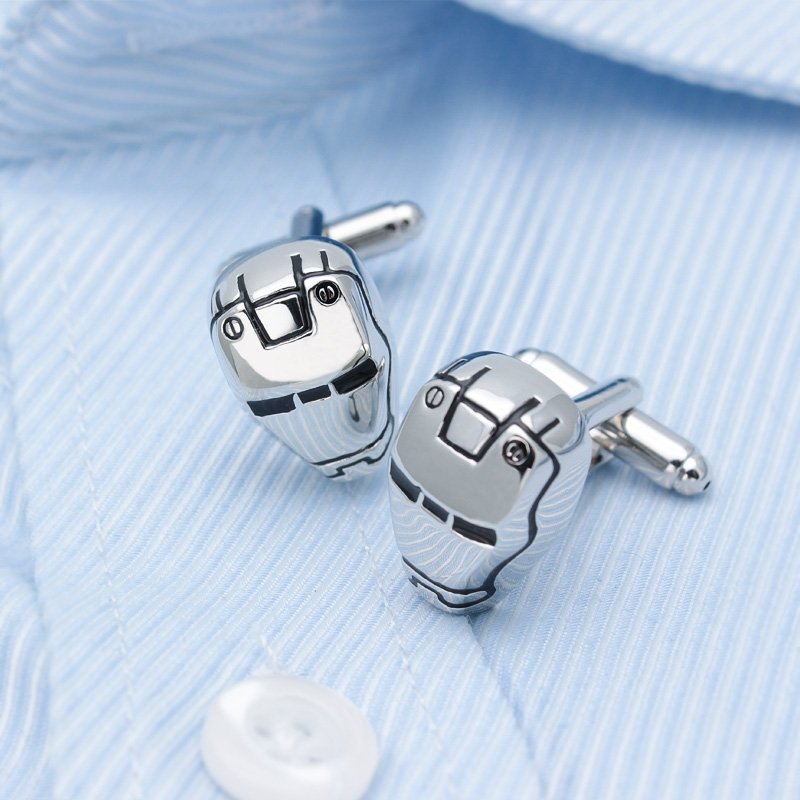 Metallic robot-themed cufflinks on shirt