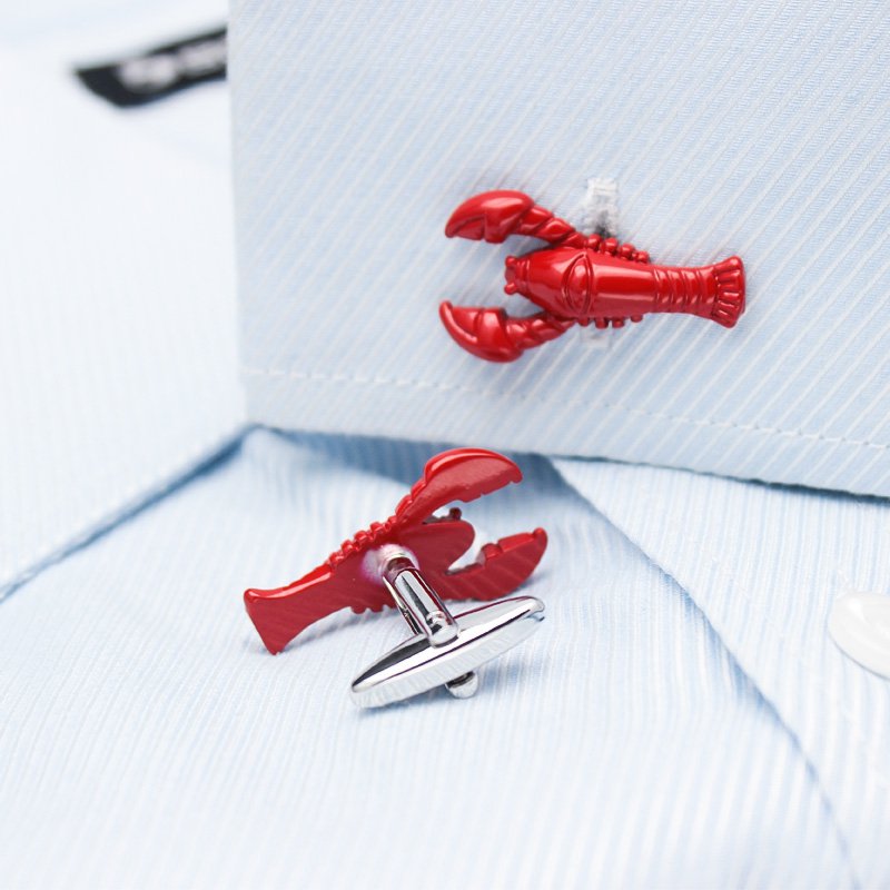 A pair of elegant lobster cufflinks made from titanium alloy, featuring a polished finish and unique lobster design, presented in a stylish box.