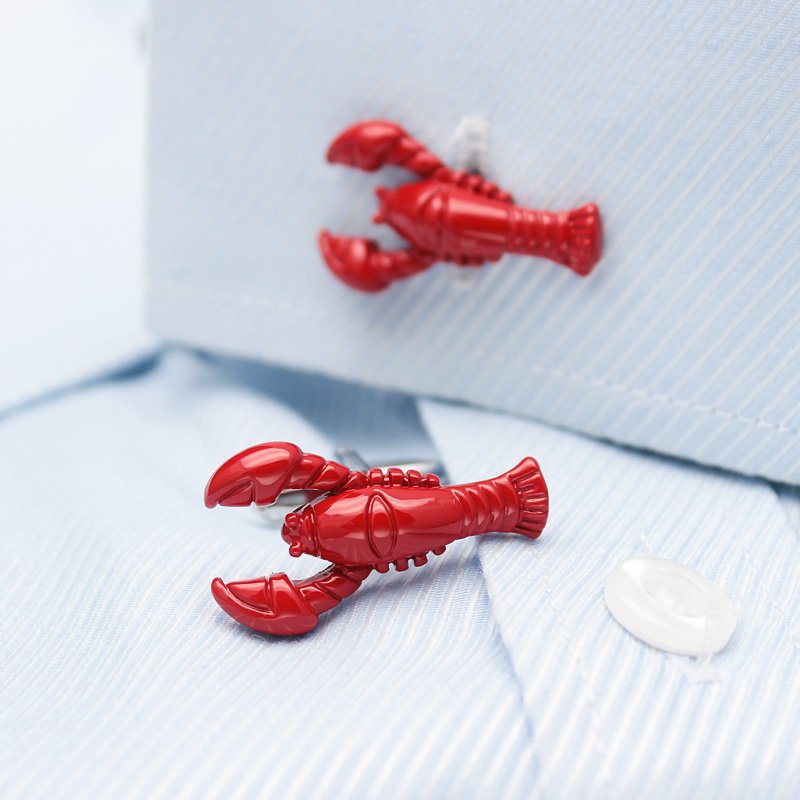 A pair of elegant lobster cufflinks made from titanium alloy, featuring a polished finish and unique lobster design, presented in a stylish box.