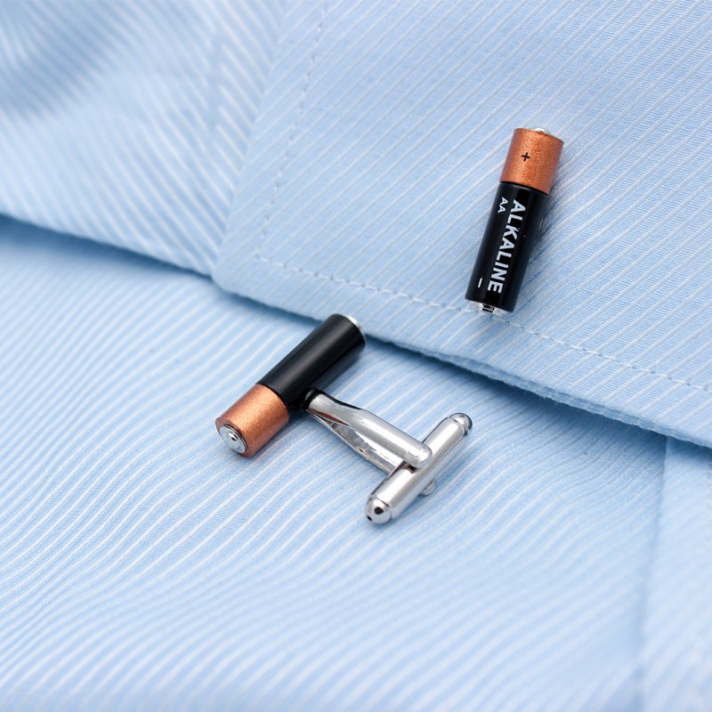 A pair of stylish Mini Battery Cufflinks made from titanium alloy, featuring a unique battery design, presented in a hard-sided gift box.