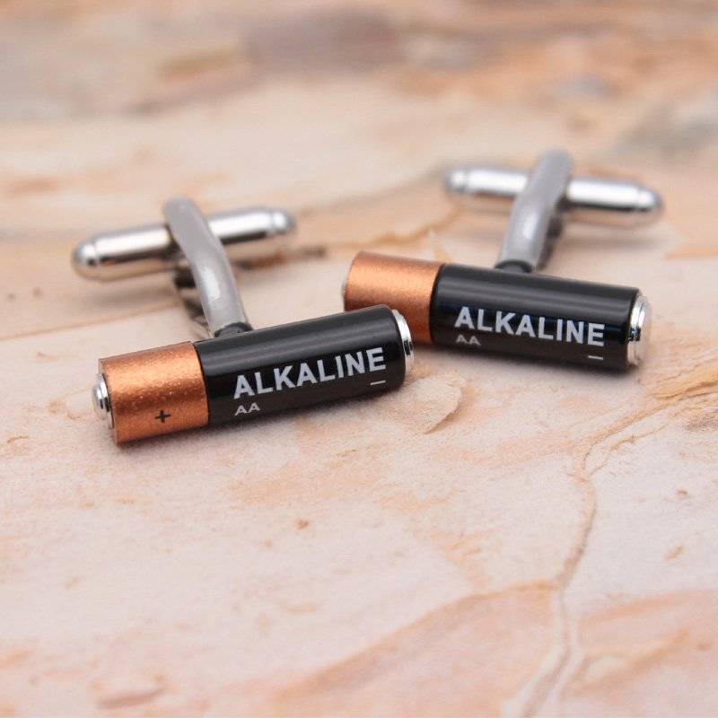 A pair of stylish Mini Battery Cufflinks made from titanium alloy, featuring a unique battery design, presented in a hard-sided gift box.