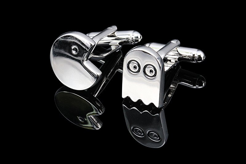 Stylish Pac-Man Cufflinks made of brass and stainless steel, featuring a playful design, presented in a hard-sided gift box.