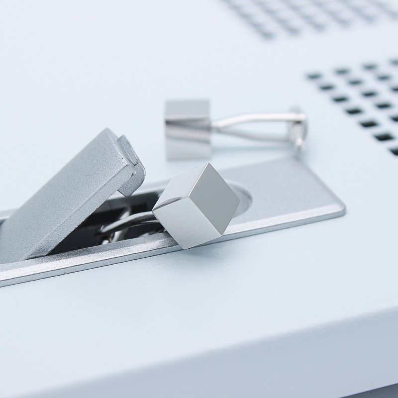 A pair of stylish Personalized Iron Cube Cufflinks made from titanium alloy, featuring a modern cube design, presented in a sleek gift box.