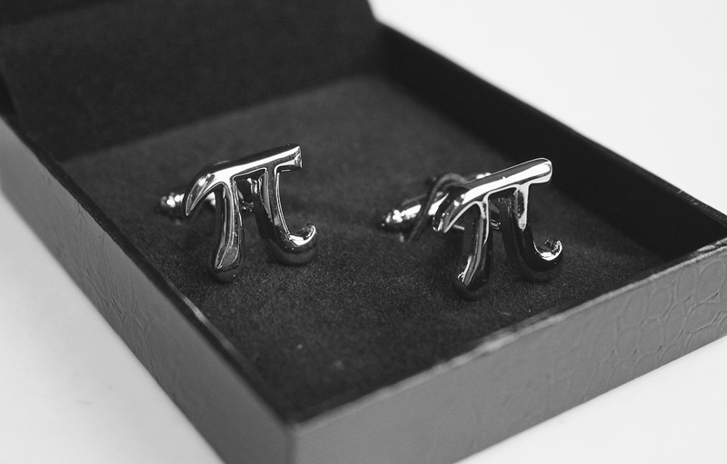 Elegant Pi π Math Cufflinks made of brass and stainless steel, featuring a polished rhodium finish, presented in a stylish gift box.