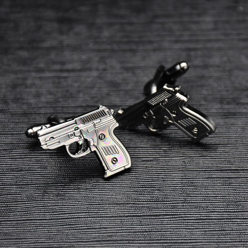 Stylish Pistol Cufflinks made from titanium alloy, featuring a unique design and luxurious finish, presented in an elegant gift box.