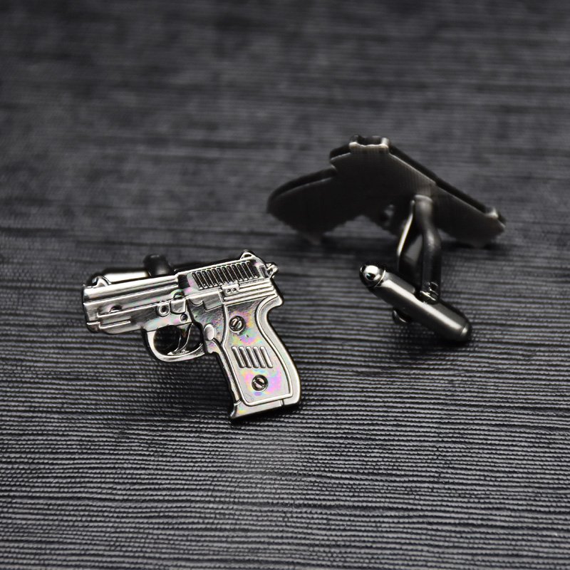 Stylish Pistol Cufflinks made from titanium alloy, featuring a unique design and luxurious finish, presented in an elegant gift box.