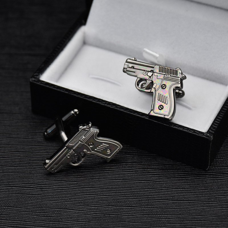 Stylish Pistol Cufflinks made from titanium alloy, featuring a unique design and luxurious finish, presented in an elegant gift box.