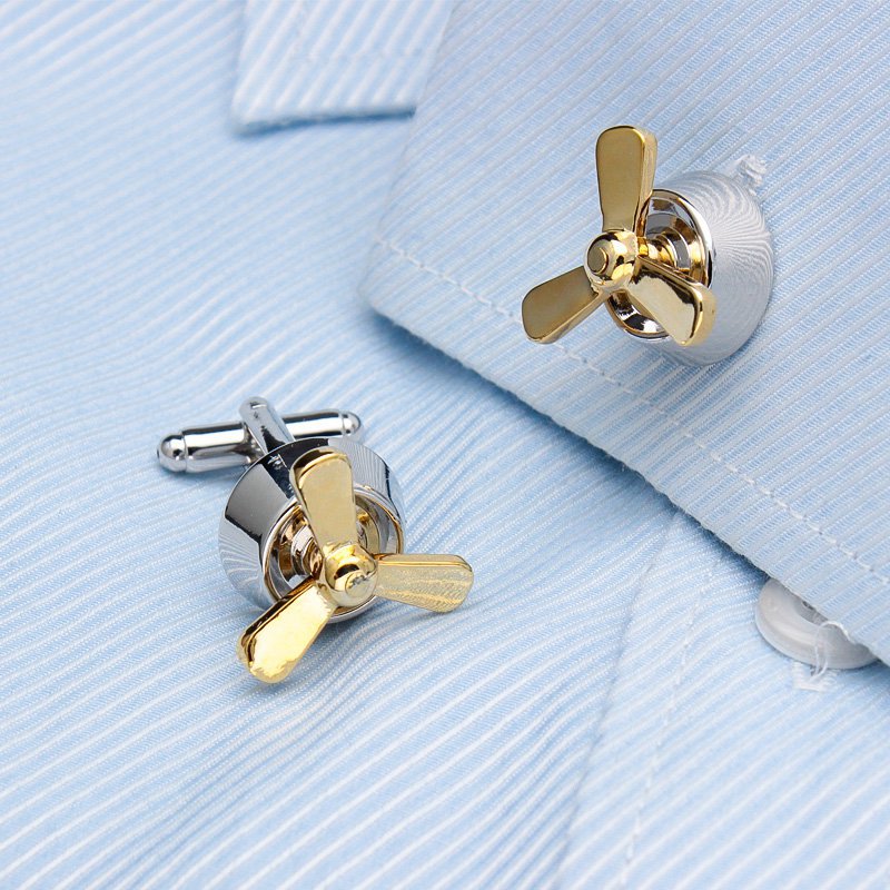 A pair of luxurious propeller cufflinks made from titanium alloy with chrome plating, featuring a unique rotating design, displayed in a hard-sided presentation box.