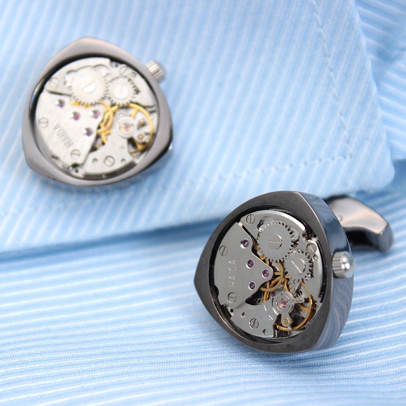 Rotor Motors Watch Engine Cufflinks made of titanium, featuring a moving watch engine, available in black, silver, and gold colors, presented in a gift box.