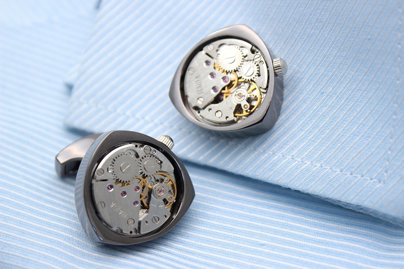 Rotor Motors Watch Engine Cufflinks made of titanium, featuring a moving watch engine, available in black, silver, and gold colors, presented in a gift box.