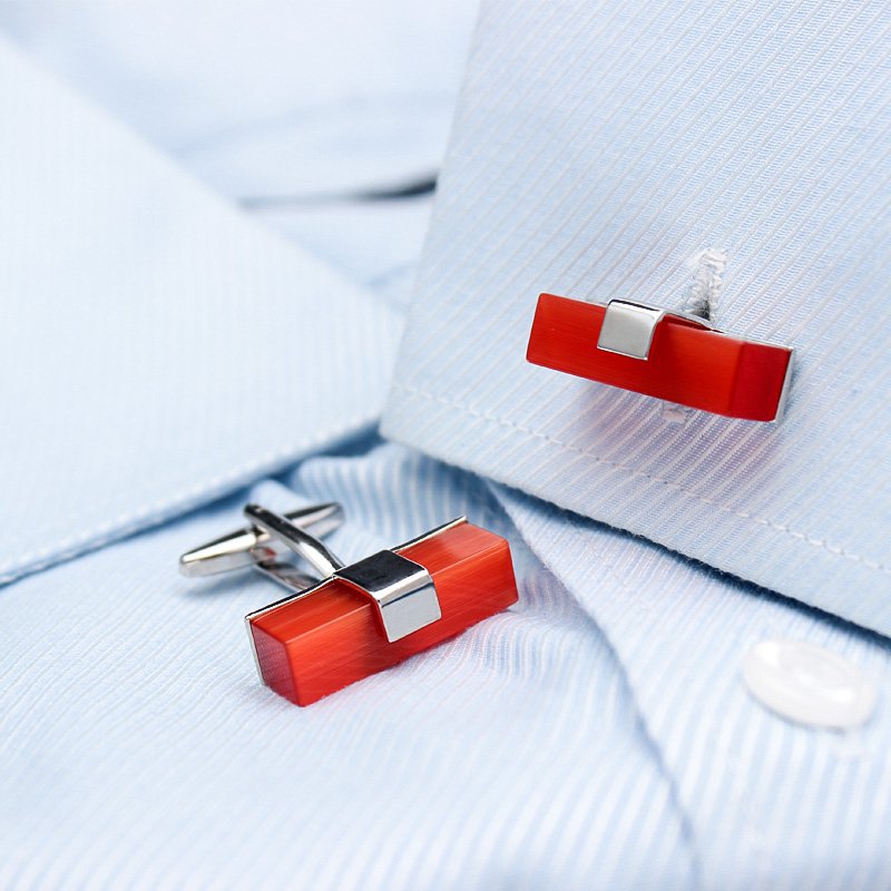 A pair of elegant Ruby Cufflinks made from titanium alloy with artificial ruby, displayed in a luxurious presentation box.