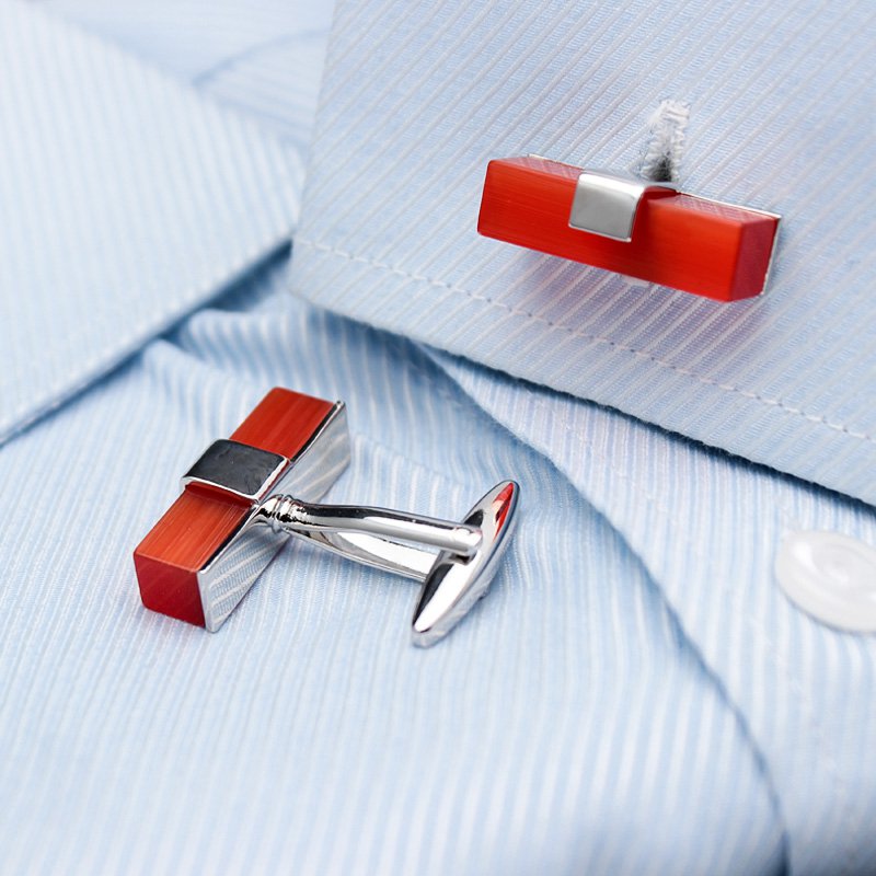 A pair of elegant Ruby Cufflinks made from titanium alloy with artificial ruby, displayed in a luxurious presentation box.