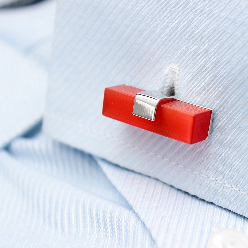 A pair of elegant Ruby Cufflinks made from titanium alloy with artificial ruby, displayed in a luxurious presentation box.