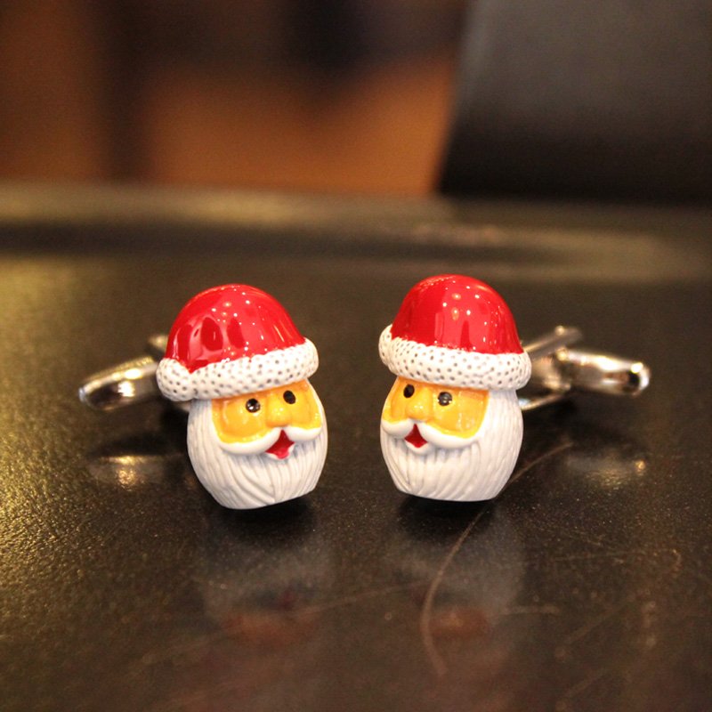 A pair of festive Santa Claus cufflinks featuring red gloves, made of stainless steel and rhodium plated, presented in a stylish gift box.