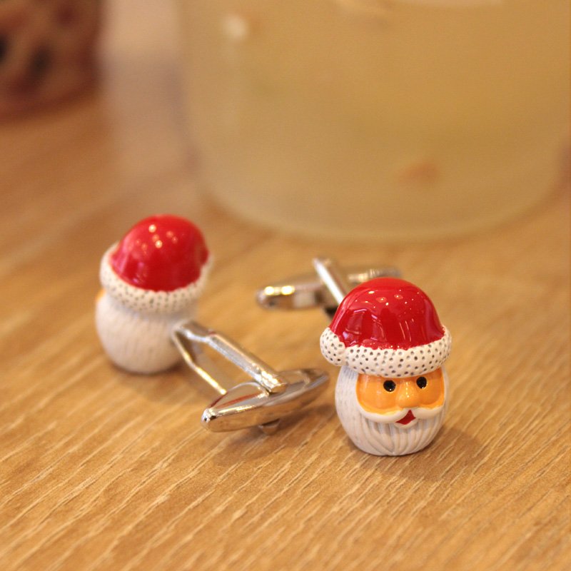 A pair of festive Santa Claus cufflinks featuring red gloves, made of stainless steel and rhodium plated, presented in a stylish gift box.